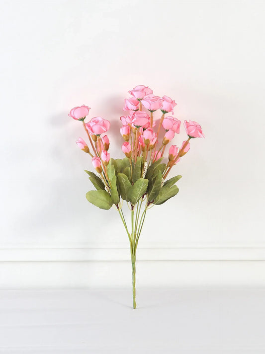 Bouquet of pink artificial flowers on a white background