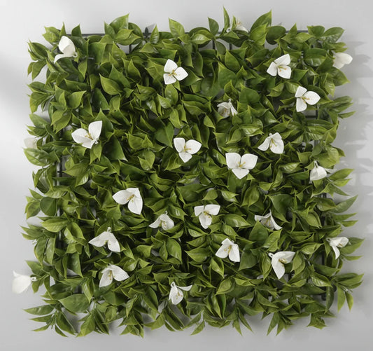 Square arrangement of green leaves and white flowers on a light gray background